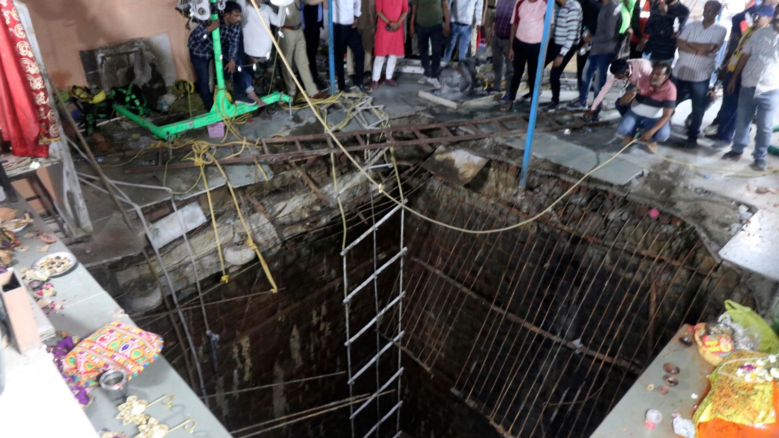 At least 35 people killed after falling into well during celebration at Indian temple