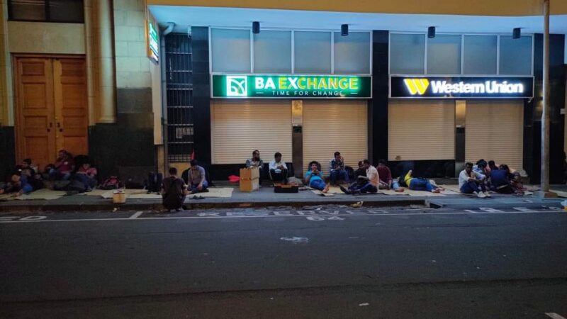 Migrant workers start queuing at night to transfer money overseas